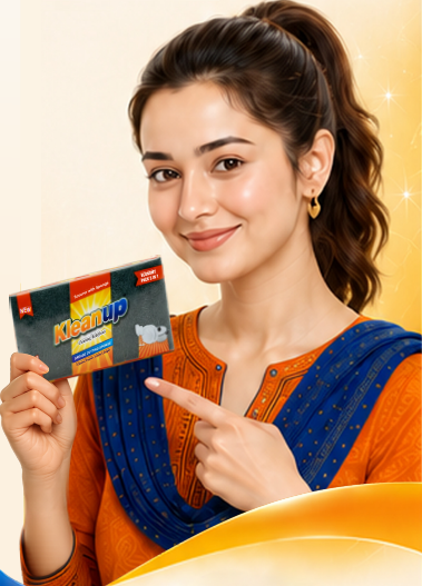 Smiling woman holding a KleanUp scouring pad